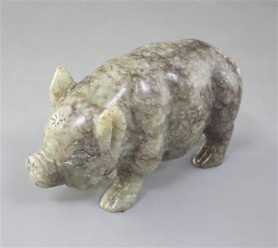 A Chinese celadon and brown jade figure of a pig, standing on all fours, length 10.7cm